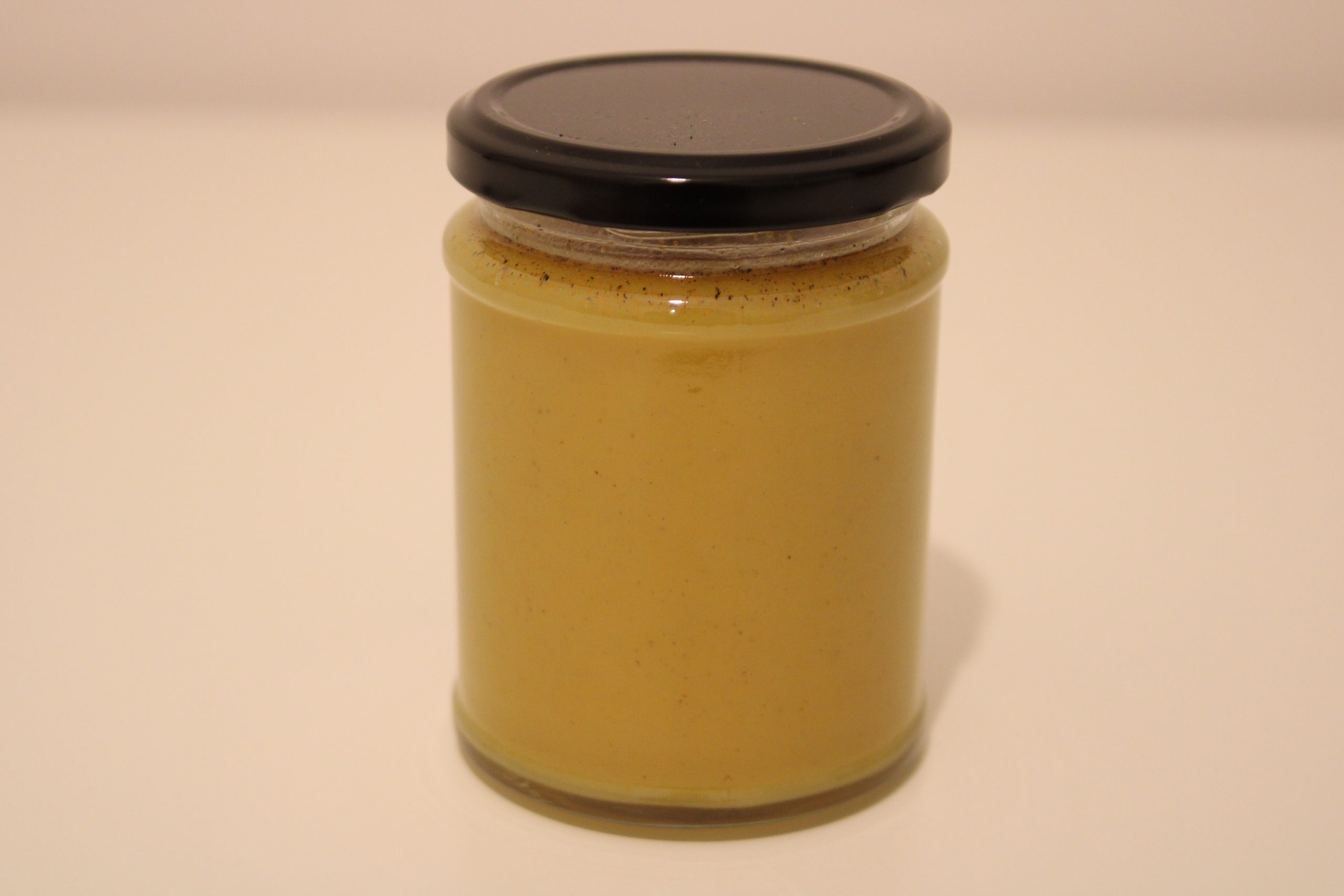Honey with Turmeric - 345g Glass Jar 345g glass jar of raw honey blended with vibrant turmeric powder, label clearly visible