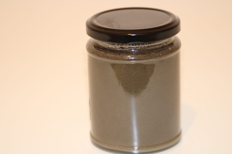345g glass jar of raw honey blended with black seeds (Nigella sativa), label visible