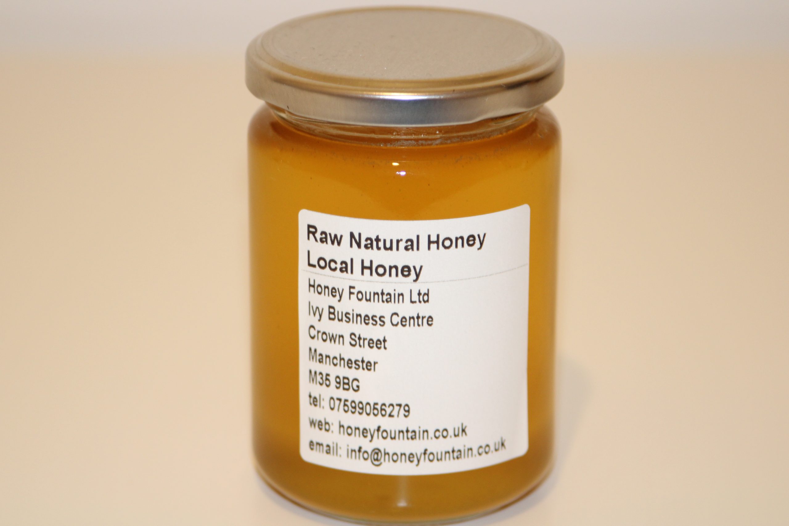 Filtered Honey - 475g Glass Jar 475g glass jar of locally sourced filtered honey with clear label and golden honey visible